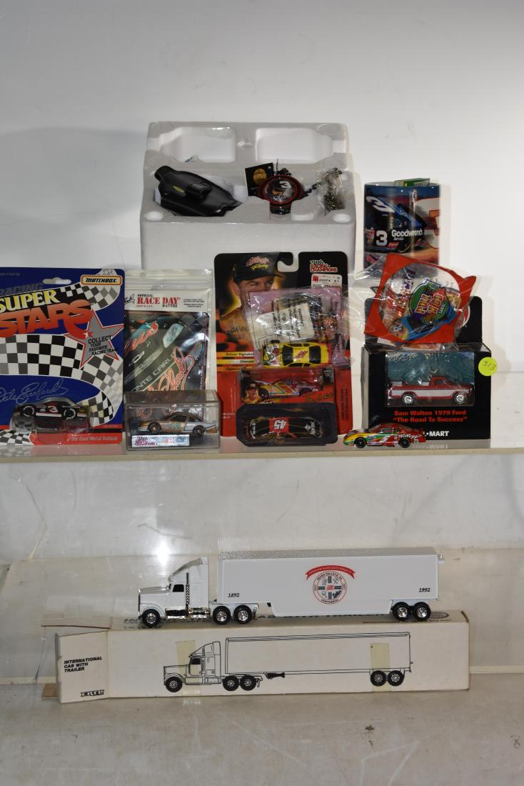 Dale Earnhardt and Die Cast Grouping: Including an Earnhardt pocket watch, Earnhardt coffee mod, #3 car on hang card , seven small nascar vehicles and a Seven Vally die cast 18 wheeler.