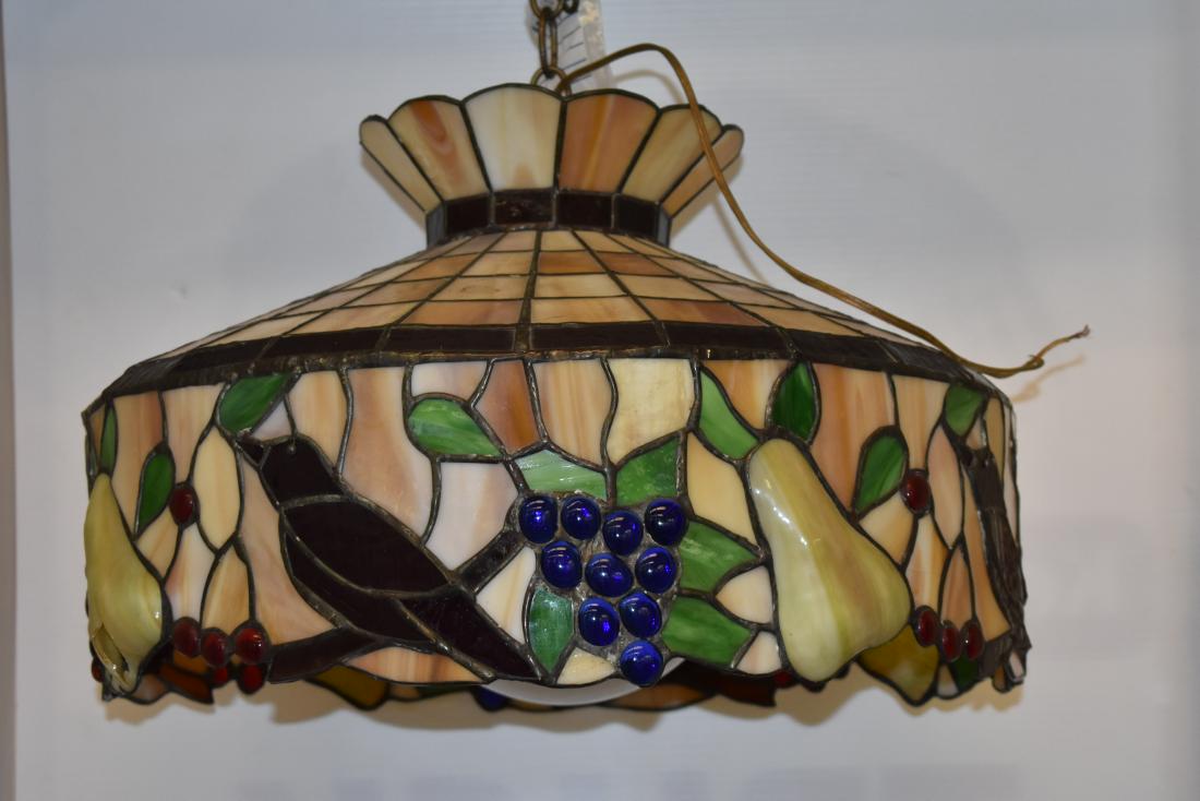 Vintage Stained Glass Hanging Lamp: Measures approx 12" high and 20" diameter. Has a bird and fruit motif and dates to the 1960s.