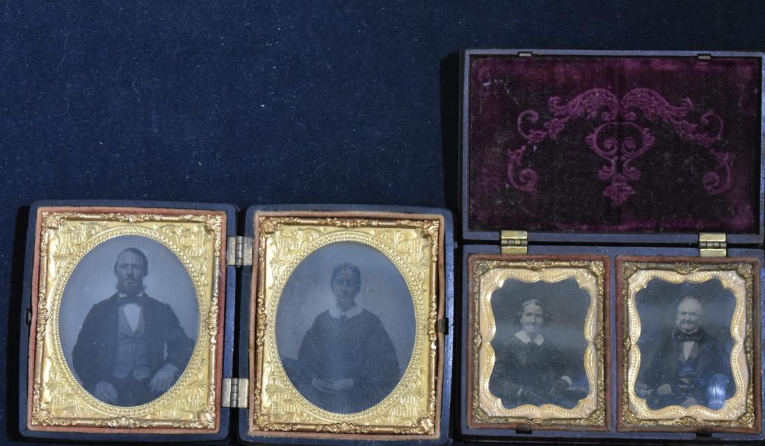 Two Gutta Percha Union Cases: Larger measures 4 1/2"h x 3"w. It depicts flowers and an urn on front and back. The interior is complete with two tintype photos. The second has a floral design with a gold medallion front and back. T