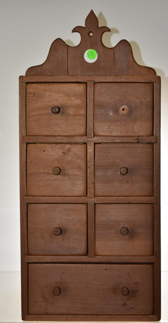 Hanging Apothecary Cabinet: Iem measures approx. 22"h. It is softwood construction, has seven drawers nd dates to the early 20tg century.