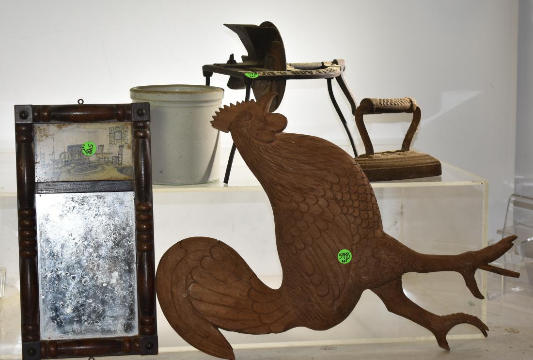 Mixed Country Grouping: Including a cherry seeder patented 1868, a sad iron, a small trumeau mirror, a small straight sided crock and a hand carved rooster missing a toe.