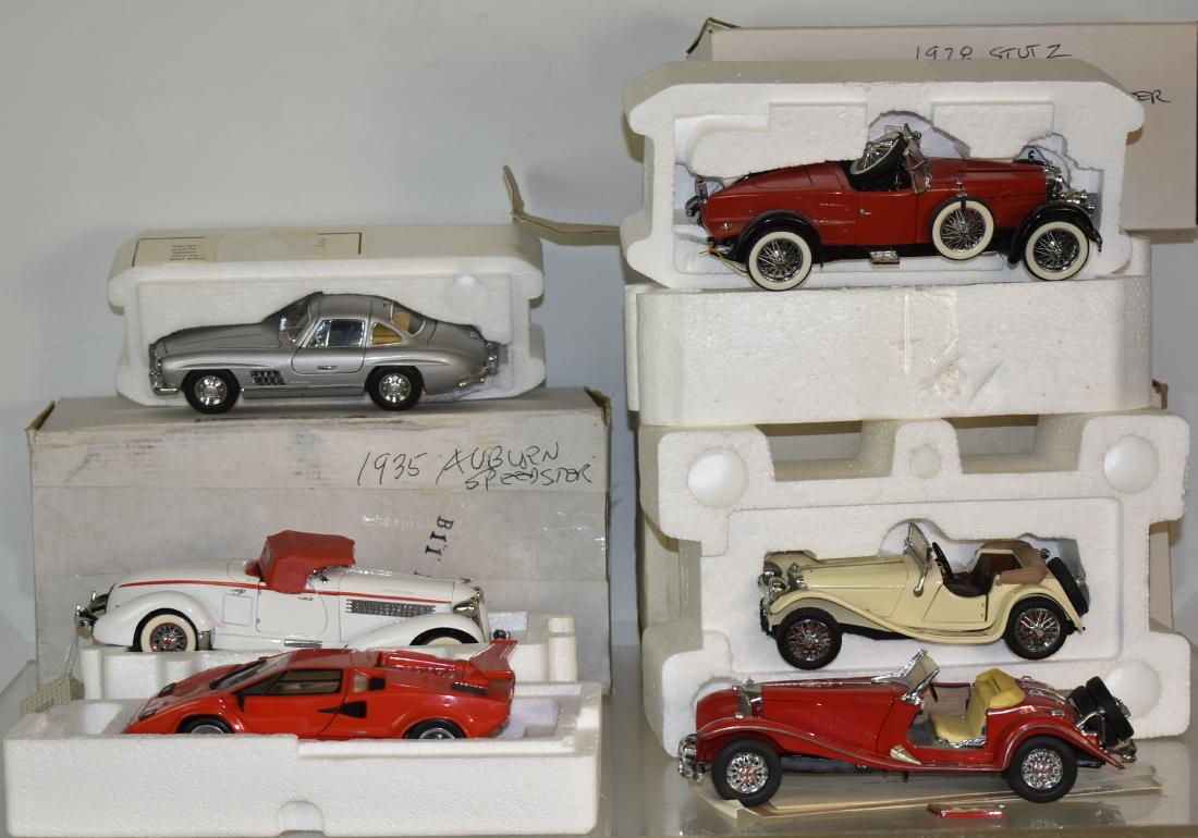 Six Large Franklin Mint Die Cast Vehicles: Including a 1935 Auburn, a Jaguar SS-100, a Lamborghini and others.
