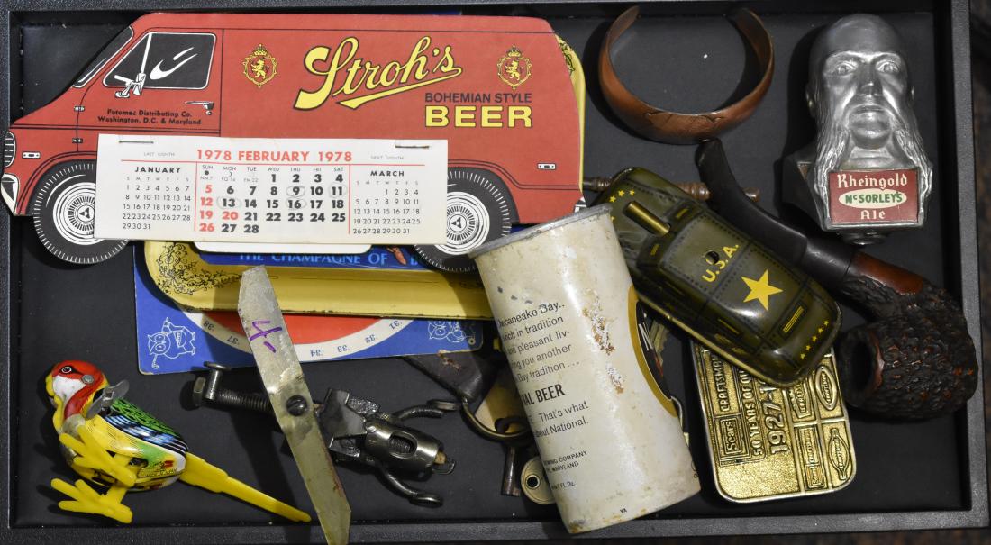 Advertising and Toys: Including a figural Rheingold beer tap, a vintage National Bohemian beer can, two Miller High Life tip trays, a wind up tin litho bird, a tin litho military car, vintage keys and other interesting ite
