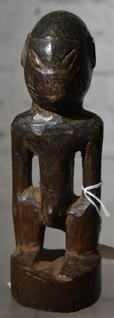 African figural Carving: Antique African wood carving of a male figure