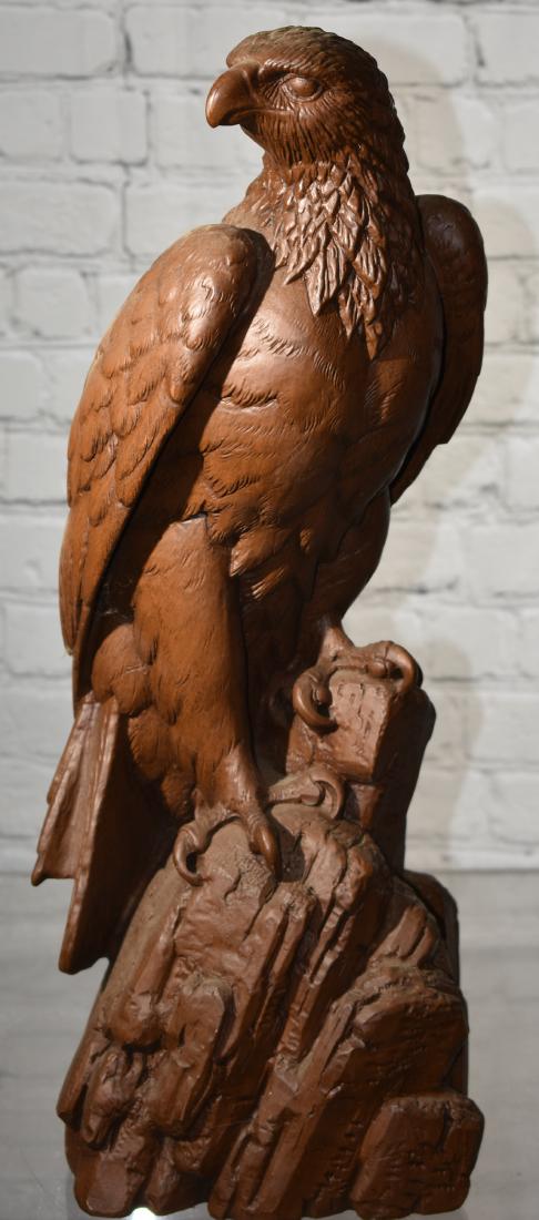 Figure of an Eagle by "Red Mill Mfg": Item measures approx. 20"h. It is a poly resin figure. The original tag on the bottom reads "Red Mill Mfg hand crafted USA".