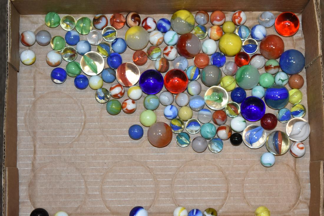 Grouping of Vintage Marbles: Including fifteen knucklers, cat's eyes and multi colored swirls.