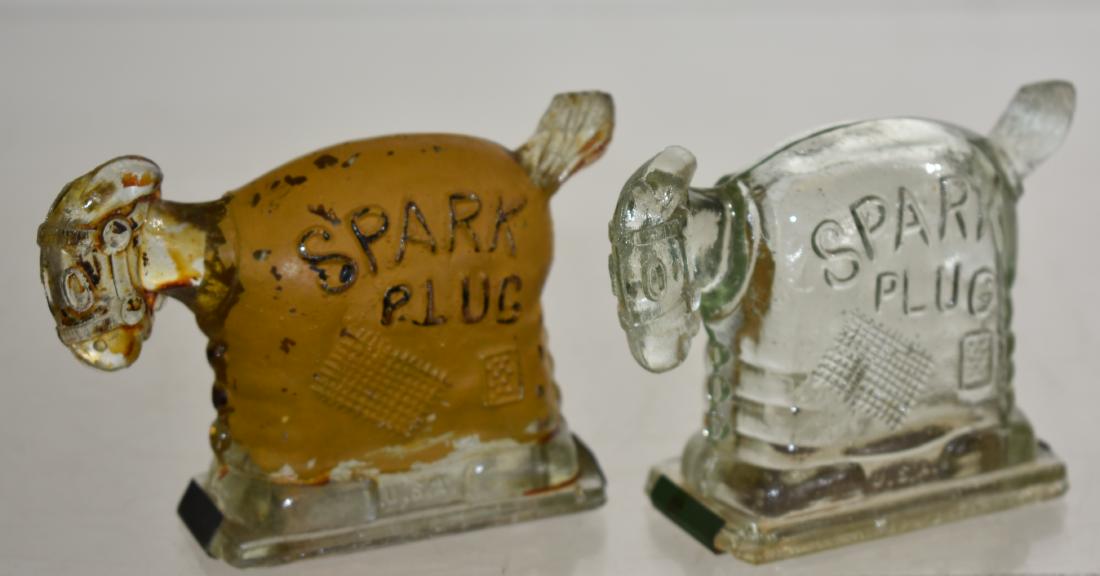 Pair of Spark Plug "The Horse" Candy Containers: Each measures approx. 3"h. One has the original yellow paint .Both have tin bottoms and are from the comic strip "Barney Google" circa 1925.