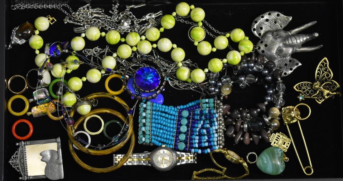 Bakelite and other Jewelry: Including eight Bakelite pinkie rings, two Bakelite bangles, a southwestern style bracelet, a necklace with a large blue stone, a lady's Pulsar watch and other quality items.