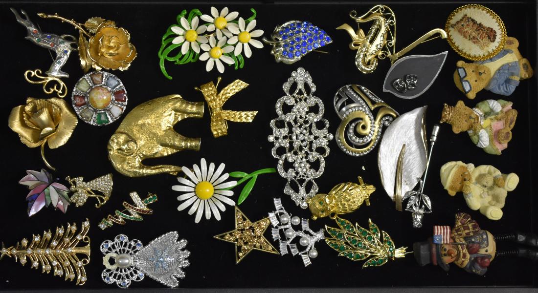 Grouping of Figural Pins: Including 1960's enameled daisy pins, holiday pins, a large pin with rhinestones and animal and leaf pins.