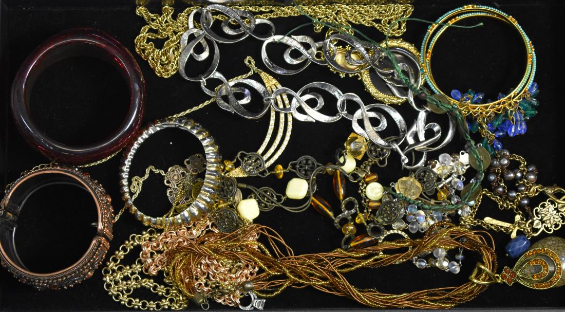 Bracelets and Necklaces: Including matching bracelets with blue dangling stones, a gold tone necklace with a cameo and a magnifying glass, a beaded necklace with yellow stones and a cuff bracelet.