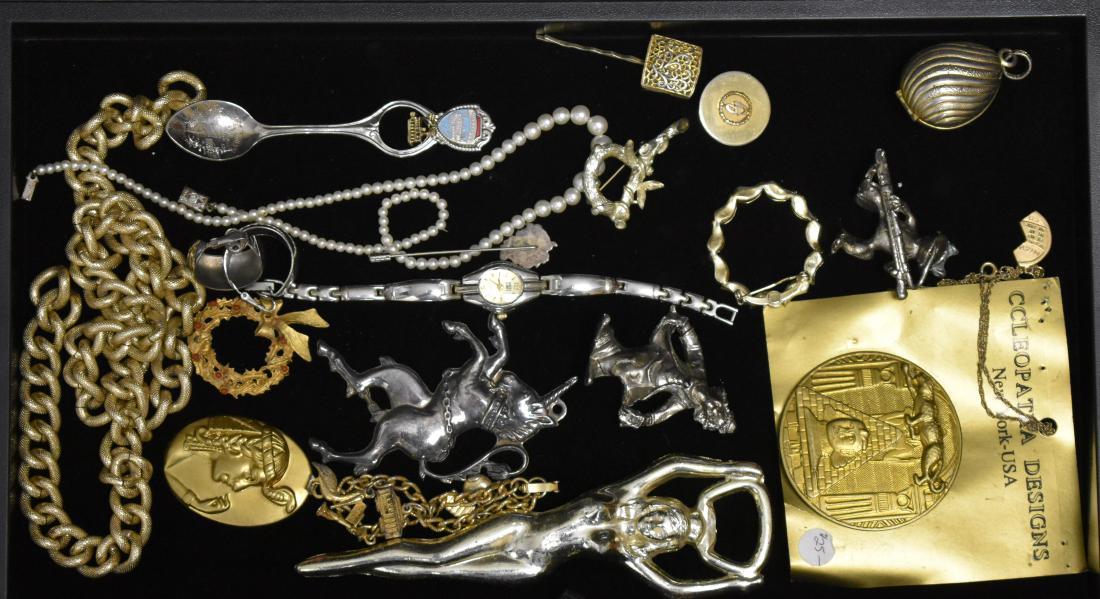 Mixed Costume Jewelry: Including a "nudie" bottle opener, a lady's "Faded Glory" wrist watch, a large unicorn pendant, a musical frog pendant and other items.