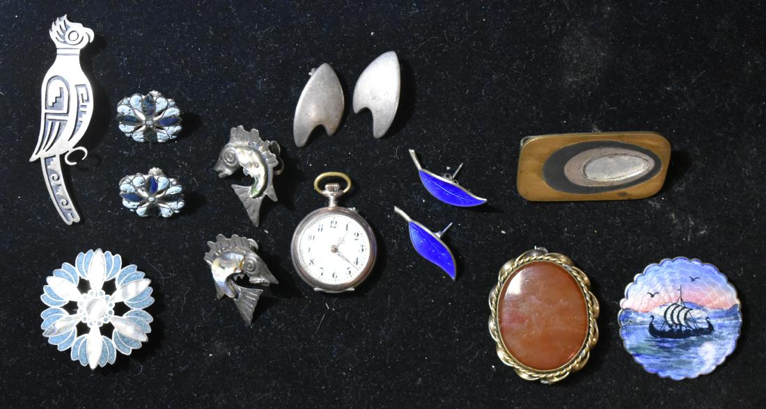 Danish Sterling and other Silver Jewelry: Including an enameled sterling pin with a Viking ship marked "H Sterling Norway" , a pair of "David Anderson" blue enameled leaf earrings, a Victorian carnelian pin, an 800 silver lady's pocket watch,