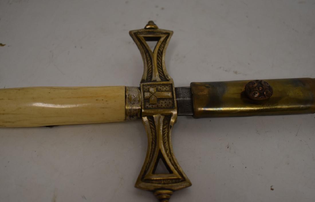 Masonic Sword with Sheath: Sword measures approx. 38" in length. It has a bone handle and brass mounts and is marked "Wilson & Stelinager Philadelphia". Item has the original sheath.