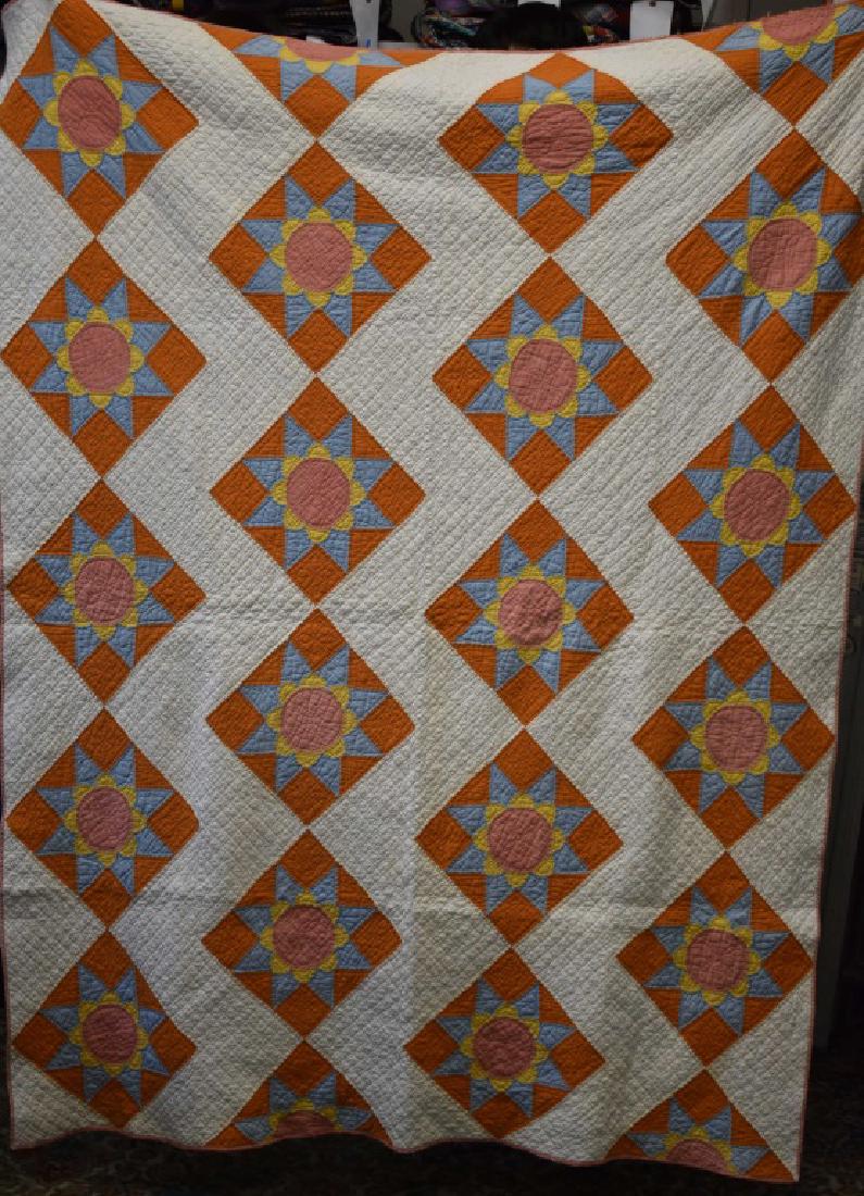 Vintage Sunflower and Star Quilt: Item measures approx. 72"h x 54"w. It has good colors and a plain white back. Back has some staining.