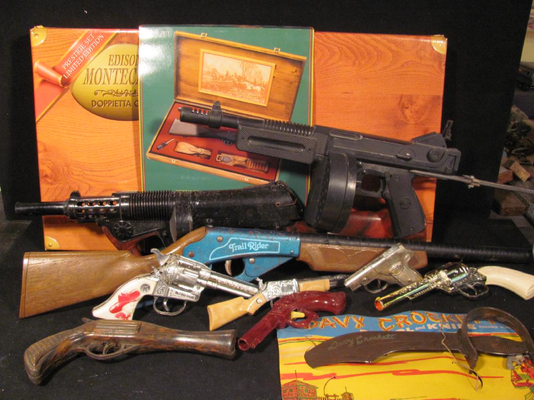 Collection of Toy Guns: Including Edison Monte Carlo cap gun in excellent condition and original box along with approximately 7 other guns by various makers including Hubley. Most are cap guns. Some guns have oxidation.