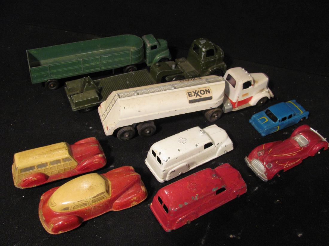 Sun Rubber and Tootsietoy Vehicles: Including 2 red Sun Rubber cars, green Ralstoy truckand trailer,& red Manoil car. Tootsietoys includes car, 2 ambulances, and 2 Trucks with Exxon Oil on one and other appearing to be missing accesssar