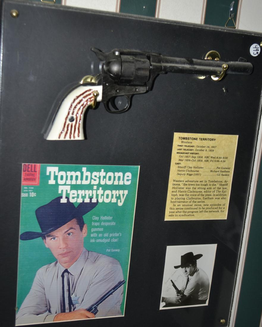 Tombstone Territory display w/Denix revolver: Tombstone Territory custom display with mounted high quality cast metal "Denix" replica revolver, comic book cover, picture and information card. Approx. 17" x 20"