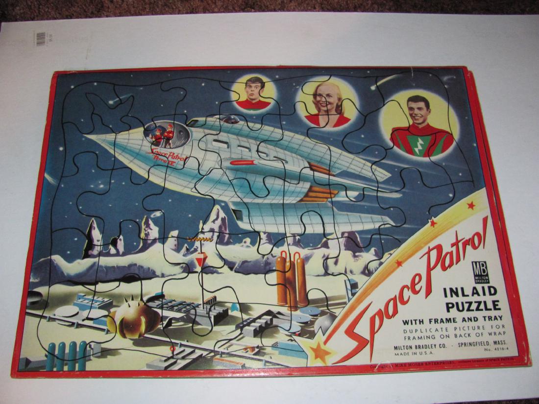 Space Patrol Secret Diplomatic Pouch and Puzzle: including (1) Vintage Space Patrol Secret Diplomatic Pouch complete with all stamps, coins, albums, and paper in plastic sleeve and (2) vintage Milton Bradley inlaid Space Patrol puzzle with original 