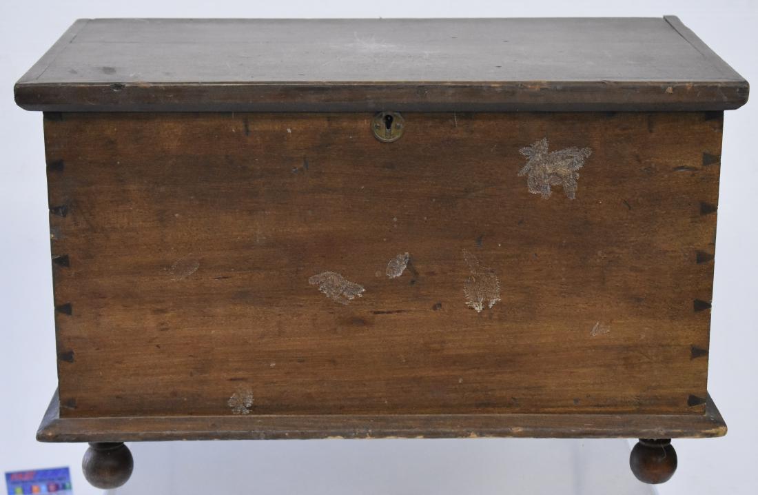 19th Century Miniature Dove Tailed Blanket Chest: Item measures approx. 12"h x 19"w x 11"d. It is softwood construction. Box has replaced hinges, one replaced bottom board and stands on a ball foot. Item shows wear consistent with age and usage.