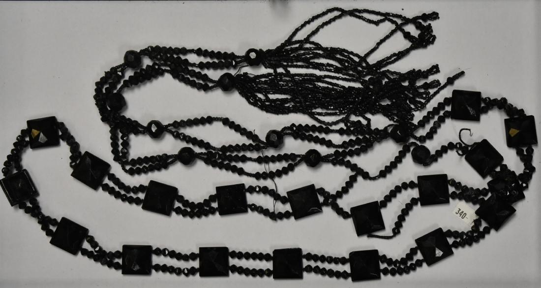 Large Onyx Victorian Necklace: Item measures approx. 74" in length. It has beaded tassels on each end and has four breaks on the stranding.