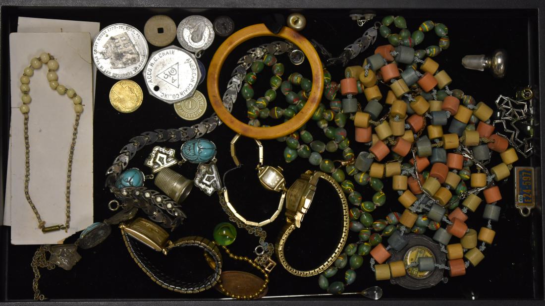 Watches and Quality Costume Jewelry: Including a man's Benrus shock resistant wrist watch, a vintage Benrus marked "Swiss", a choker necklace with blue scarabs, two Czech child's necklaces, wooden necklaces and other items.