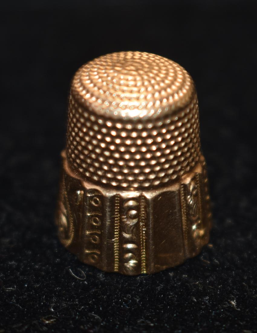 14K Gold Thimble: Item weighs approx. 3.1 dwt. It is nicely decorated and marked 14K in interior. Thimble measures approx. 3/4" long.