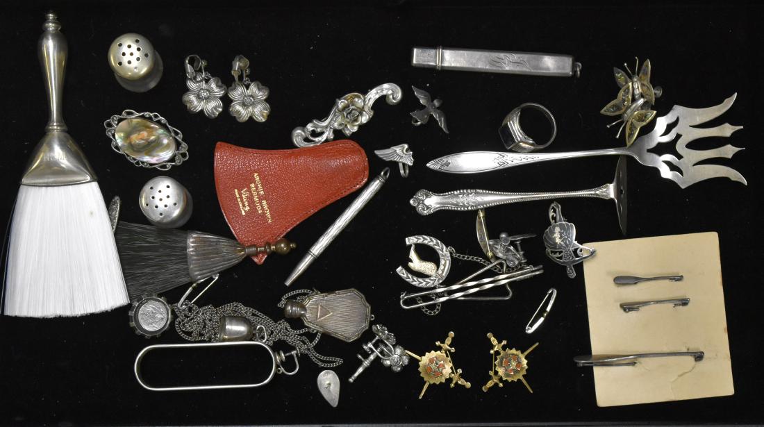 Vintage Sterling Jewelry: Including a sterling perfume bottle on a chain, two sterling powder brushes, a sterling and abalone pin, a sterling crumb, butler and serving fork, a Damascene ballerina and sterling floral jewelry.