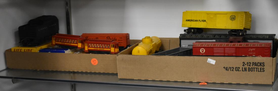 Grouping of "O and HO" Train Cars: Include25s five Lionel O gauge train cars, an American flyer O gauge coal car, a Coney Islane trolley (maker unknown) and four HO cars in boxes.