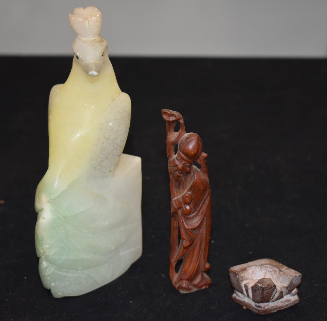Asian Jade Bird and Rosewood Diety: Nicely carved jade bird is light green to yellow in color and has some wear to the beak