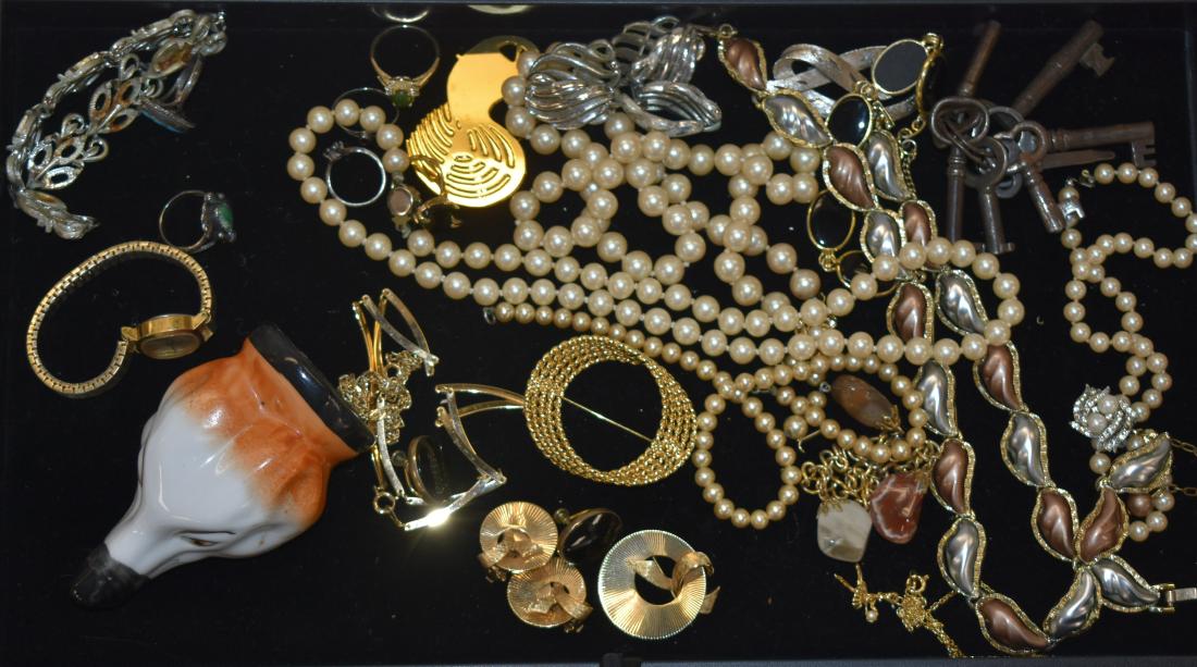 Mixed Costume Jewelry Grouping: Including a gold tone Monet pin, a silver tone pin marked "JJ", a bracelet with onyx stones, a bracelet with polished minerals, a matching bracelet and necklace set, six lady's rings - two with turquo