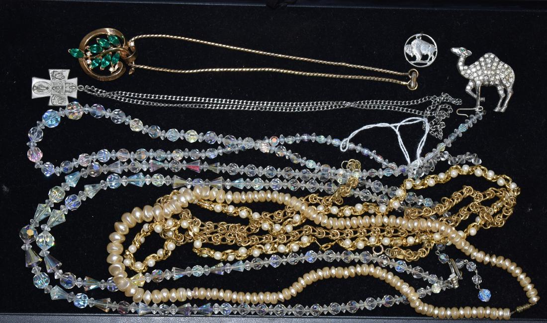Trifari and other Necklaces: Includes a gold tone Trifari necklace with green and clear rhinestones, a Trifari necklace with crystals and others.