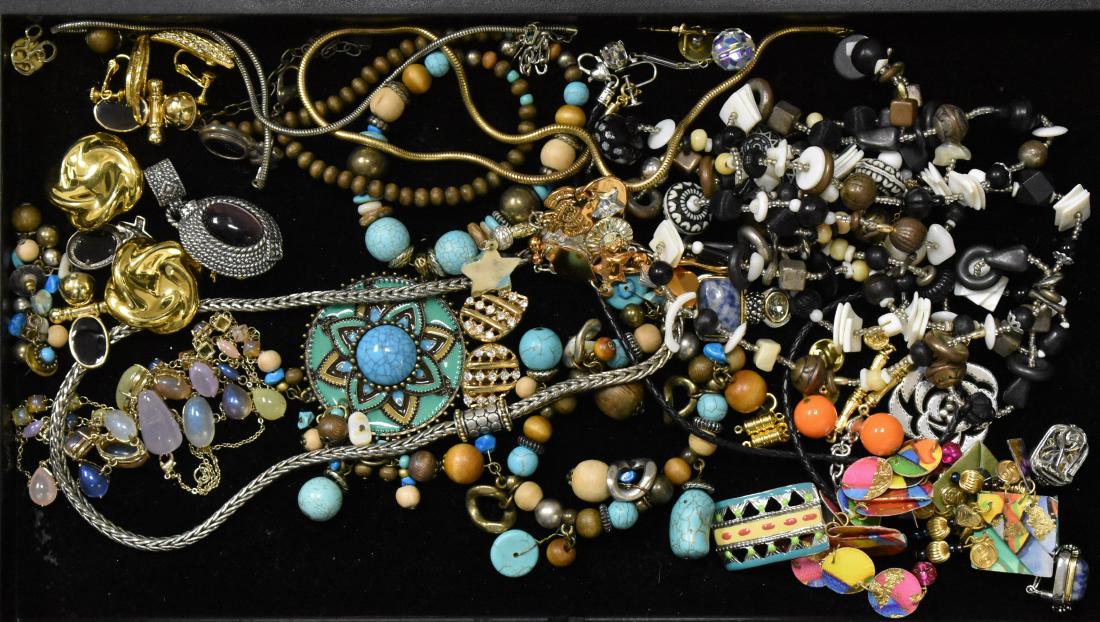 Turquoise and other Jewelry: Including a turquoise and wooden necklace with a pendant, a turquoise and wooden bracelet, a pair off gold tone earrings with crystals marked "Goldette". an insect pin and various other items.