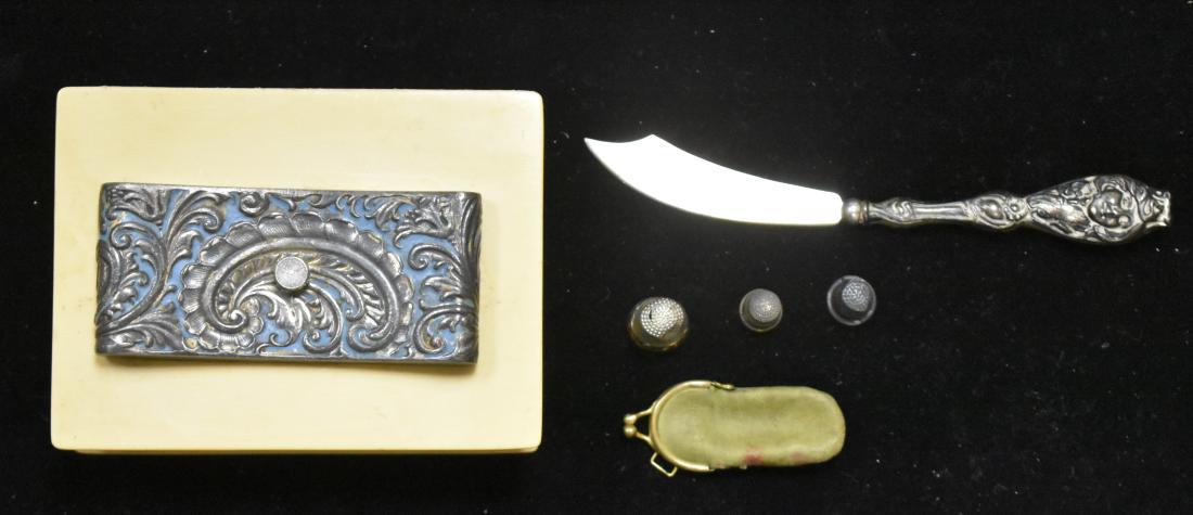 Vintage Celluloid Type Box and More: Box has a silver plated paisley decoration on top; the hinge is detached. Lot also includes a sterling handled figural letter opener and a sterling thimble in a cloth case.