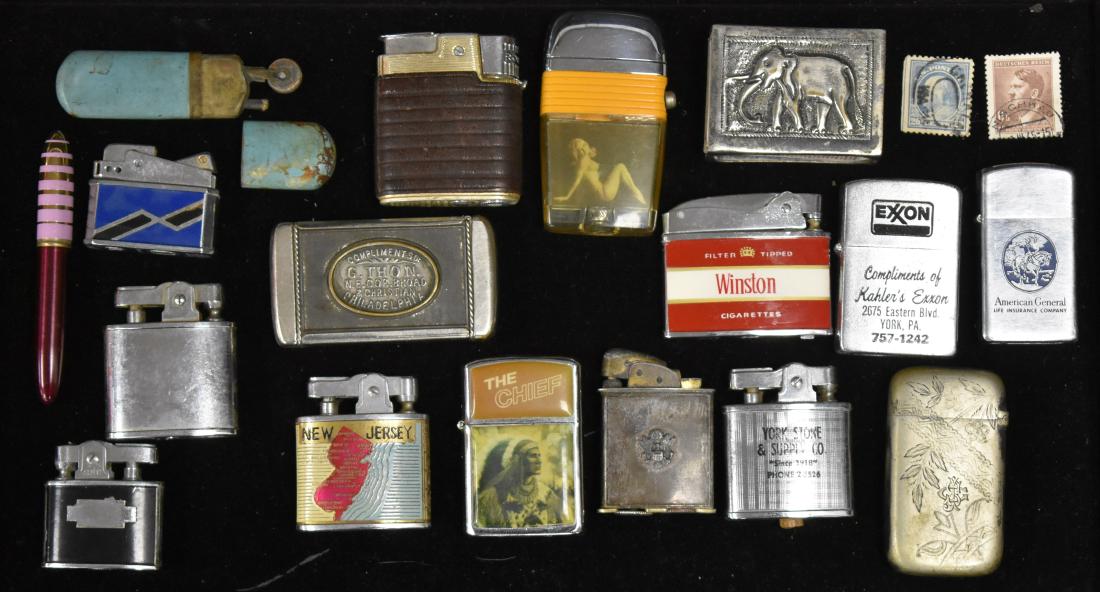Collection of Vintage Lighters: Including a Scripto Vu-Lighter with bathing beauty, a blue & black jet lighter, a Supreme lighter with a black case, a Winston Penguin lighter and other lighters and match cases.
