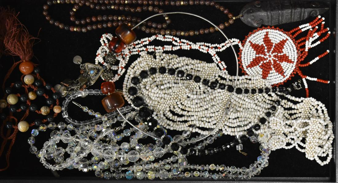 Crystal and other Necklaces: Group includes five crystal necklaces, a beaded necklace with a fertility pendant, two Native American style beaded fertility necklaces, a choker with large Bakelite beads and metal pendant and other 
