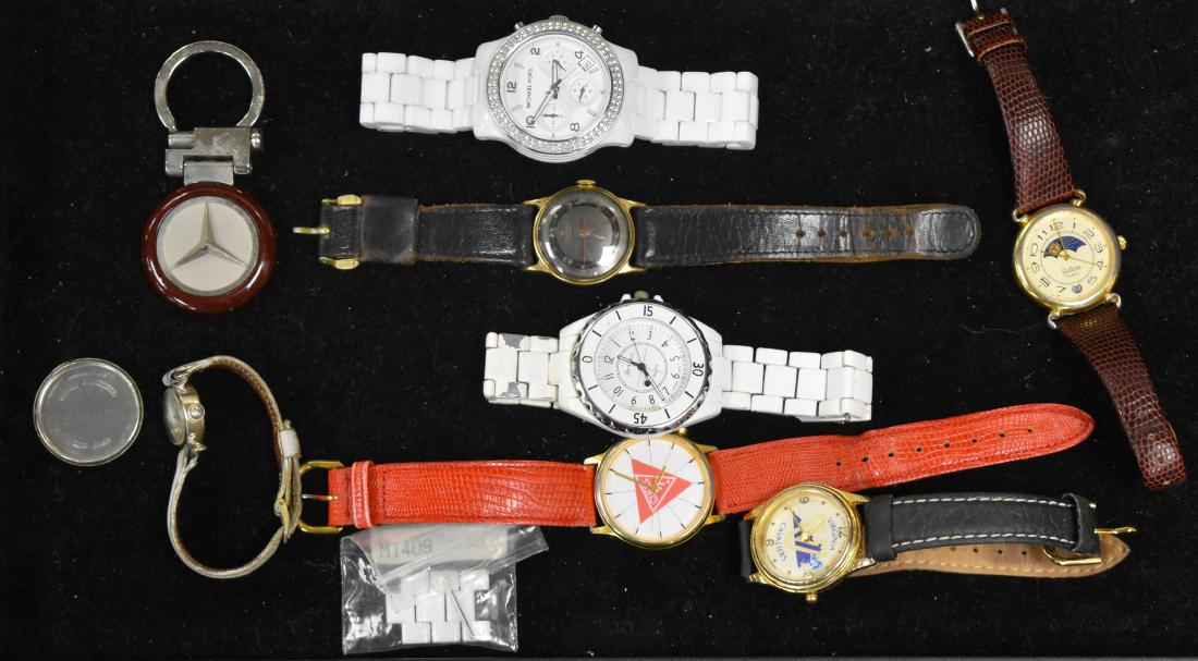 Grouping of Watches: Including a Michael Kors white diver's watch, a Davinci white diver's watch, a Sutton wrist watch with a rotating dial, a vintage lady's Hamilton and others.