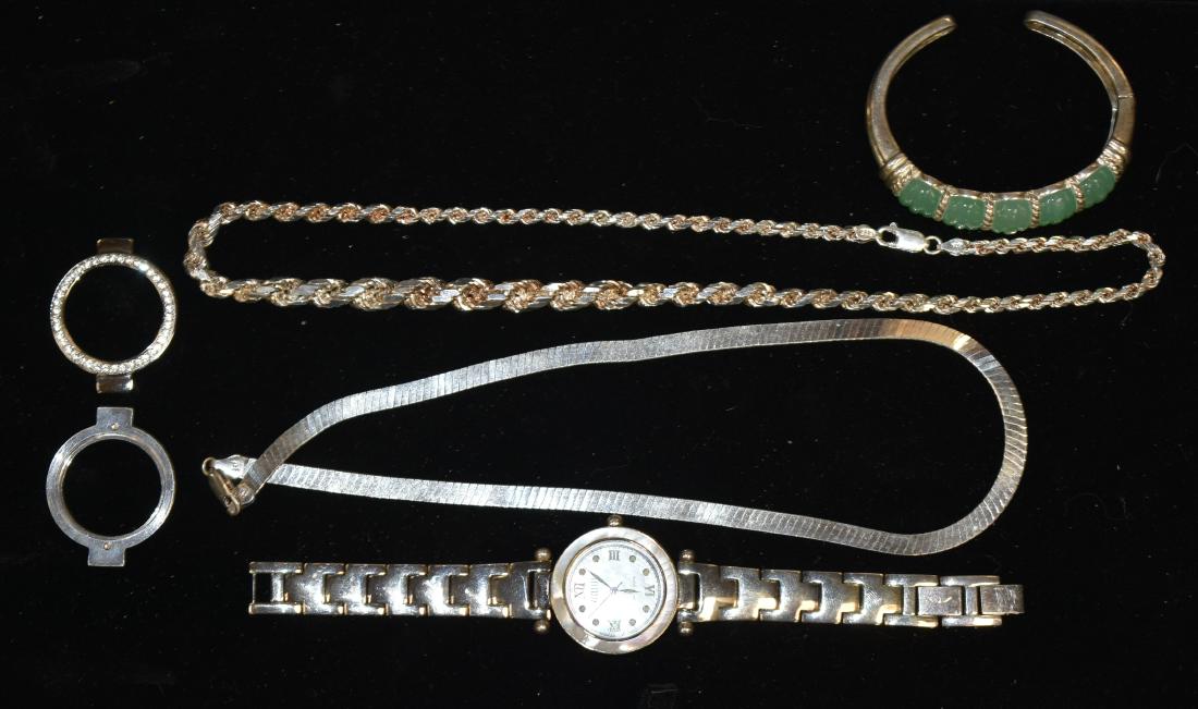 Sterling Jewelry and a Watch: Includes an "Ecclissi" sterling silver lady's wrist watch, an Italian sterling herringbone necklace, a sterling twisted chain necklace, a sterling Judith Ripka cuff bracelet. Group weighs 215 grams in
