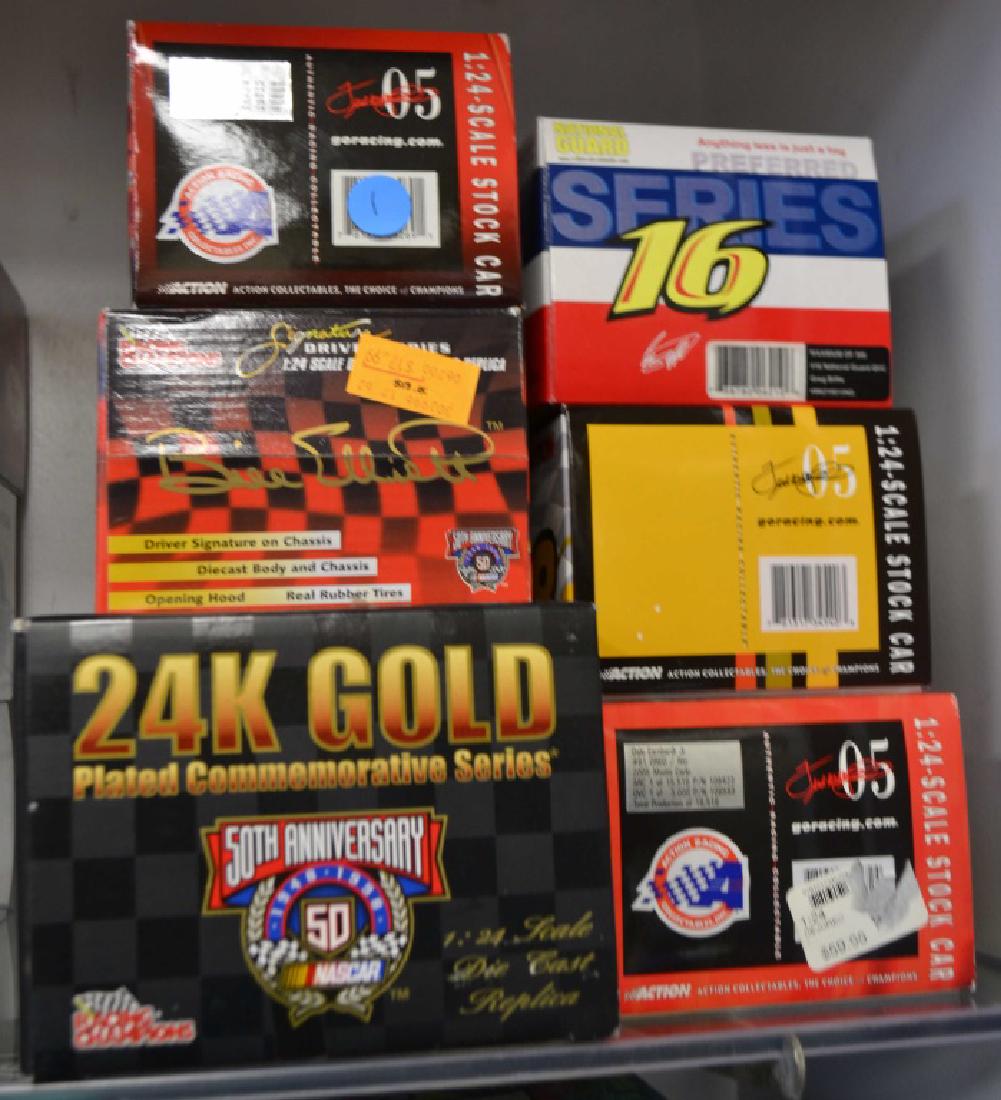 6 Die Cast Race Cars Incl. Greg Biffle Auto.: Includes autographed 2006 Greg Biffle Team Caliber car 1 of 300, Dale Jarret Action car, 2 2005 Dale Earnhardt Jr. Action cars 1 of 15,516 & 1 of 33,960, and 2 Bill Elliott Racing champions cars 1 of 