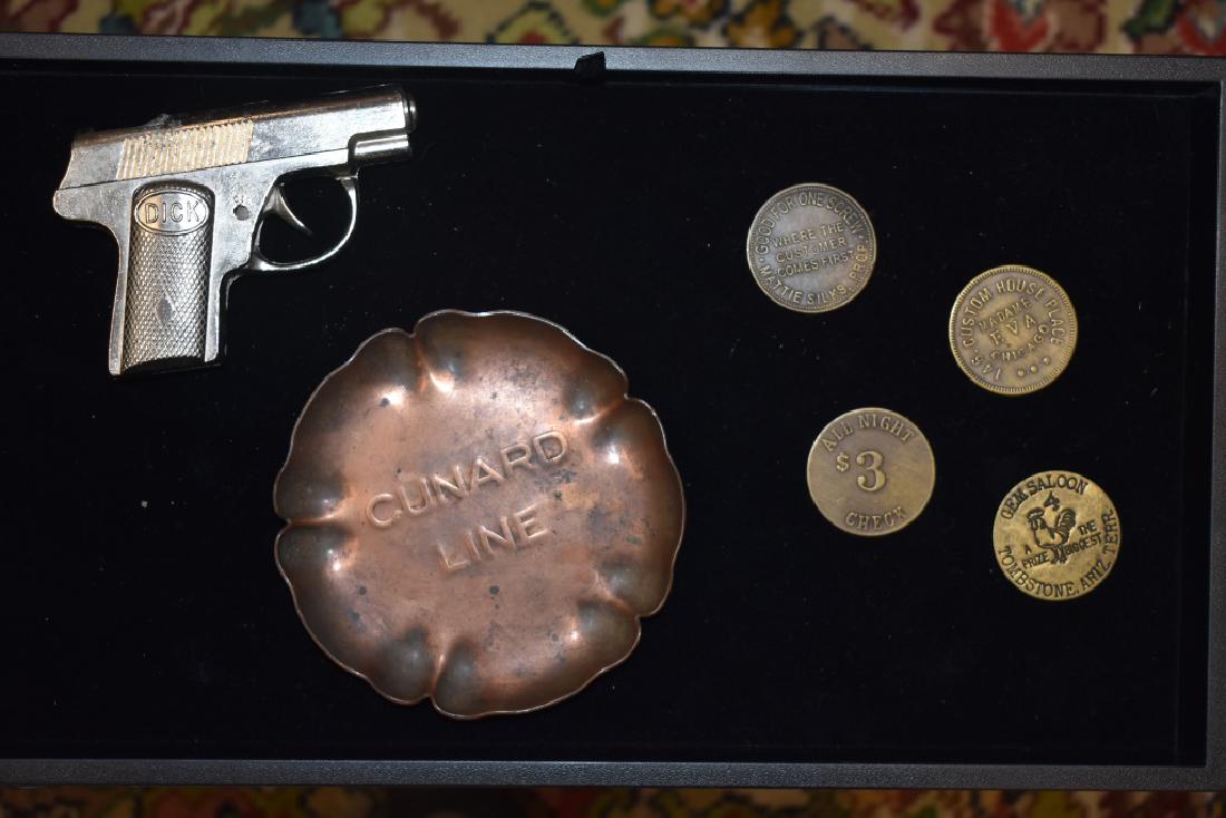 Brothel Tokens, Tip Tray, and Cap Gun: Including a copper Cunard Line tray, Dick Cap Gun with some oxidation in the interior, and four brothel tokens featuring custom house place Madame Eva Chicago, Octoroon Madame Bolanger Los Angeles 3 d