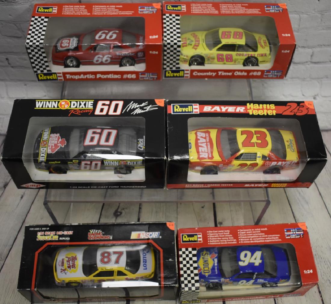 Six 1:24th Scale Die cast Cars: Including Tony LaBonty TropArtic, Bobby Hamilton, Chad Little revell cars. Mark Martin, GMP, and Joe Memechek racing champions car.