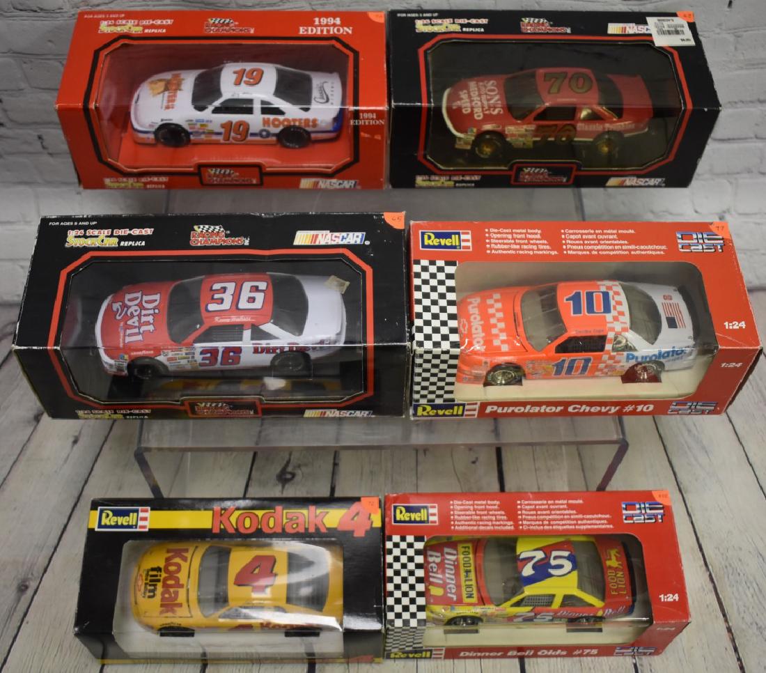 Six 1:24th Die cast Cars: Including Sterling Marlin, Dinner Bell, Derrick Cope Revell cars, Kenny Wallace, Loy Allen, J.G. McDuffie racing champions cars.