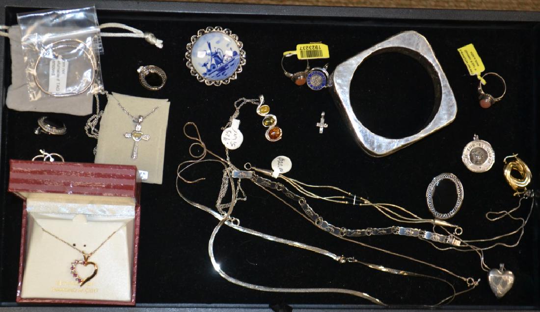Sterling Jewelry Grouping: Includes a 18K gold over sterling heart pendant on chain with diamond and ruby accents, a large sterling cuff. a Siam sterling bracelet, a sterling and onyx pin and earring set and other quality sterl