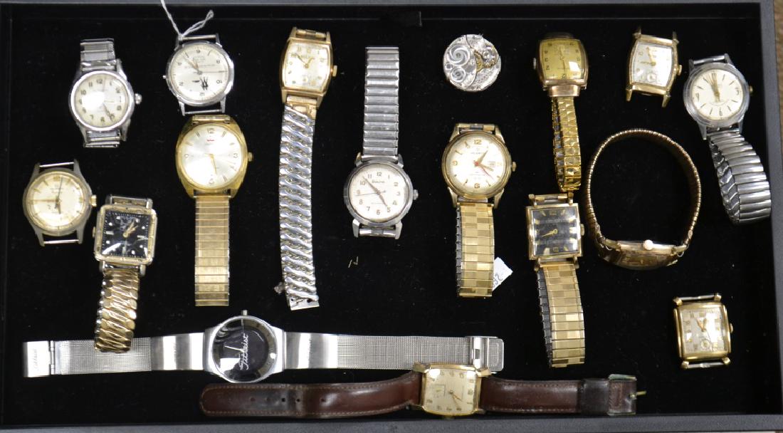 Collection of Men's Watches: Including a "Titleist", a men's "Benrus" Shock Absorber, a "Helbros" with a calendar marked "Germany", a "Helbros" Regency, a "Waltham" marked "Swiss" , a "Gruen" marked "Switzerland" and other qualit
