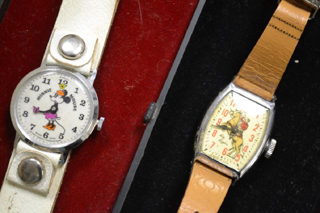 Minnie Mouse and Roy Rogers Character Watches: Lot includes a Roy Rogers character watch marked "Made in USA" with a leather band and a "Bradley" Minnie Mouse watch marked "Swiss Made" with original case (Note: watch is missing one arm).