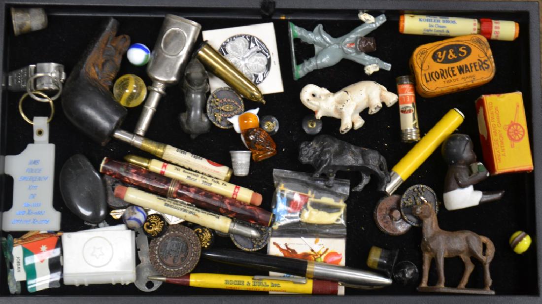Miniatures and Advertising: Includes three advertising bullet pencils, a fountain pen with a red celluloid body, a miniature cast horse and elephant, a small licorice tin, a hand carved pipe with a squirrel and other interesting