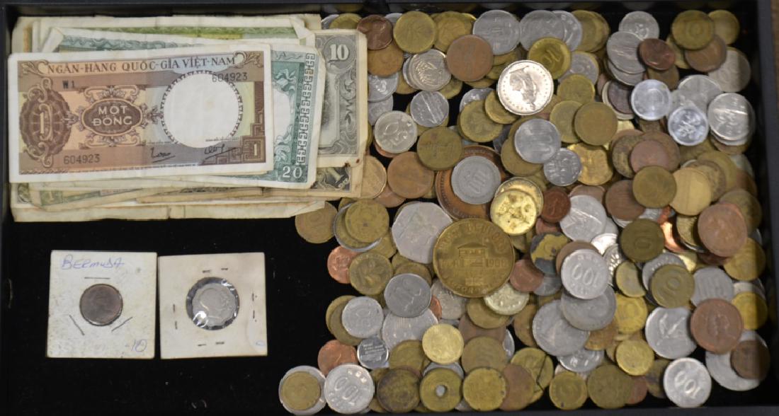 International Coins and Currency: Includes a large selection of international coins of different ages and denominations. Lot also includes vintage Vietnamese bills, vintage Japanese one peso and ten peso notes as well as other notes. 