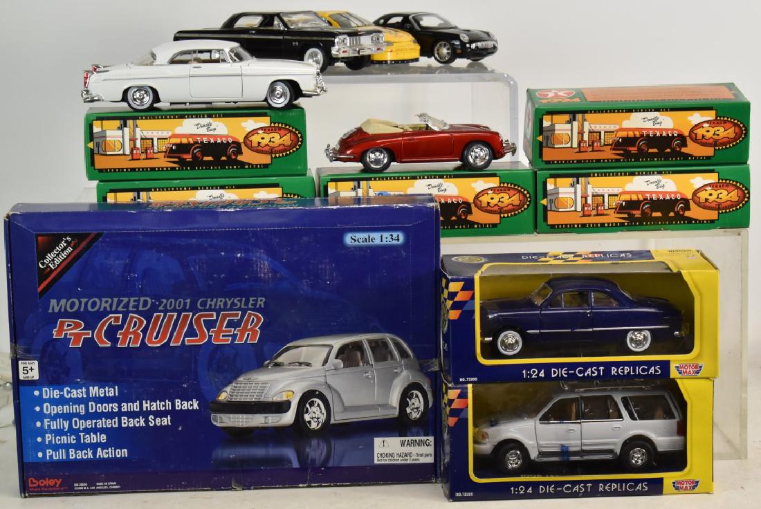 Grouping of Die Cast Cars: Thirteen cars - eight with boxes - including Texaco Doodle Bugs in boxes, Motor Max cars, a motorized PT Cruiser and others.