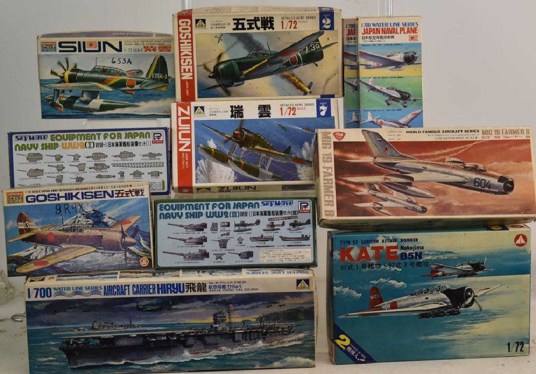 Collection of Japanese Airplanes and Ship Models: Twelve pieces including battleships and fighter planes by Roshima, Aoshima and Water Line Series Fighter planes.