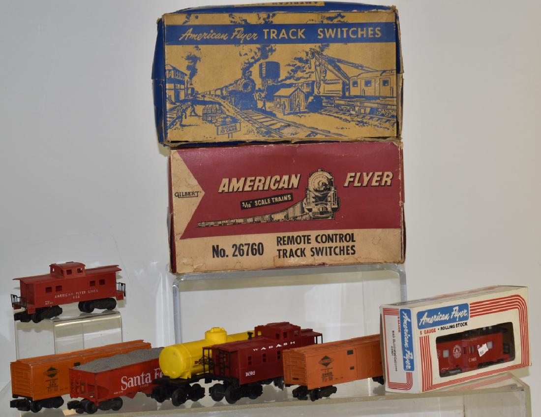 Vintage American Flyer Train Accessories: Including remote control track switchers #722A and #26760. Both in original boxes and various American flyers and other train cars.