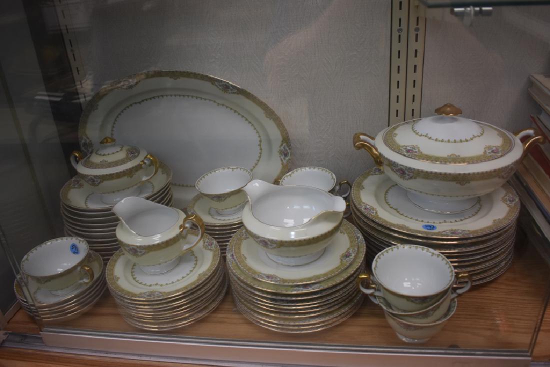 "Meito" Annette Pattern China Service: Lot consists of a service platter, a vegetable bowl, a gravy bowl, nine dinner plates, nine salad plates, ten bread & butter plates, nine cups and saucers, sugar, creamers and other items.